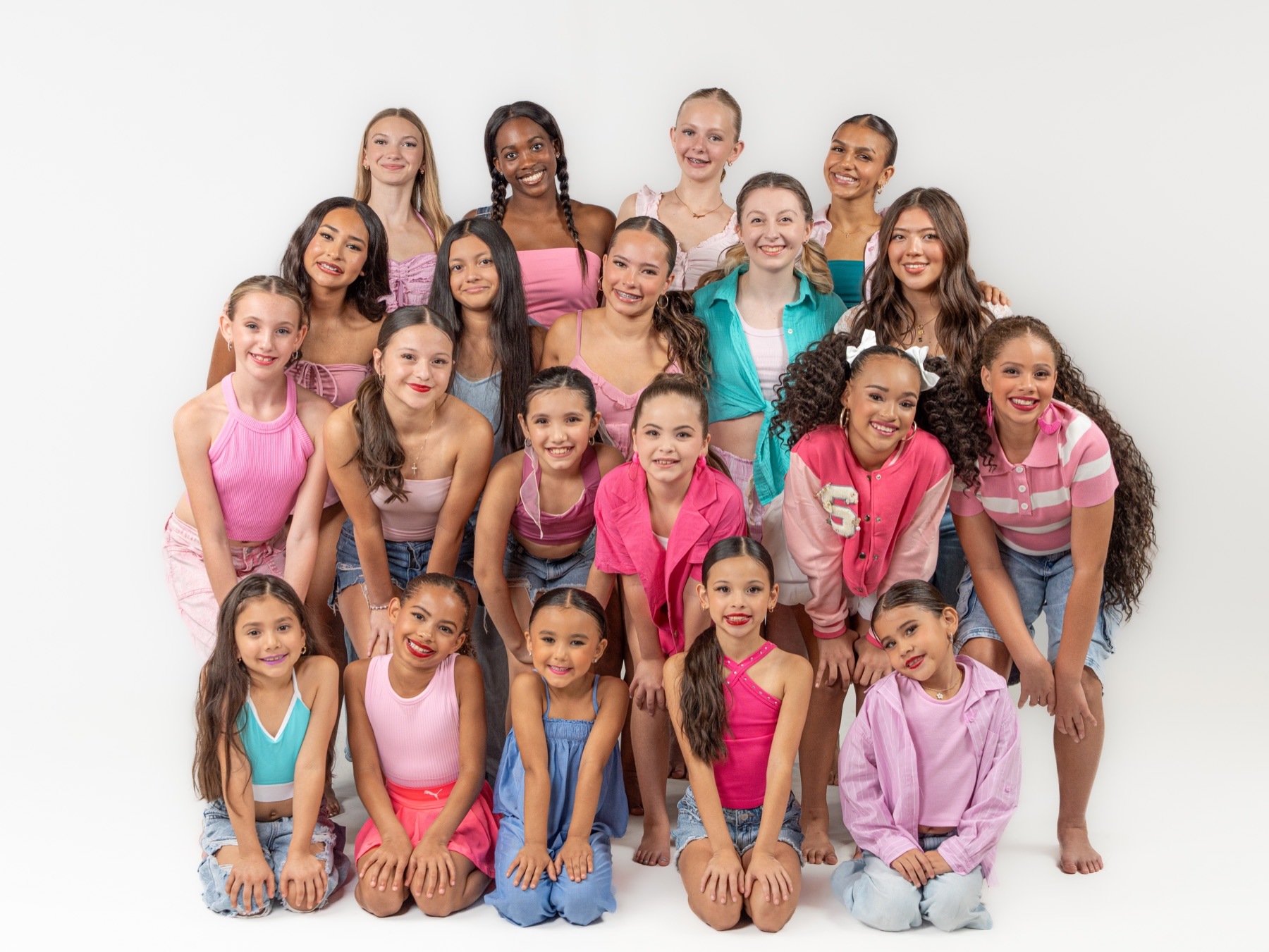 Studance Lab dancers gathered together in colorful team attire