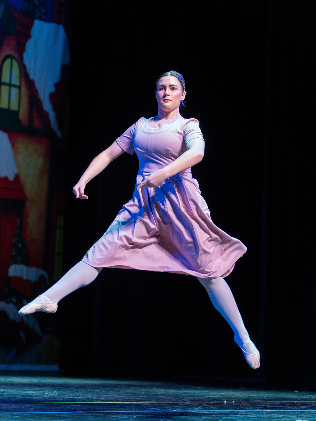 A contemporary dancer leaps across the stage